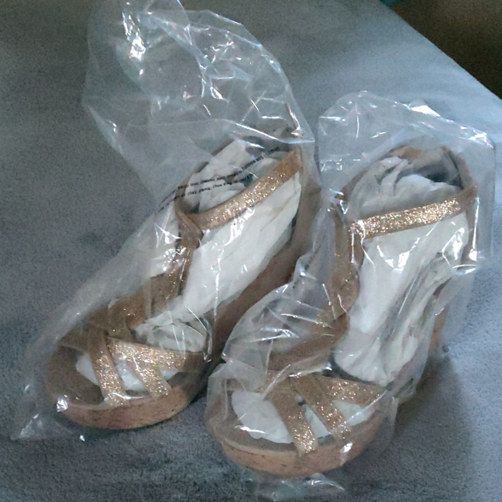 NWOT Torrid brand gold and beige wedged heels.